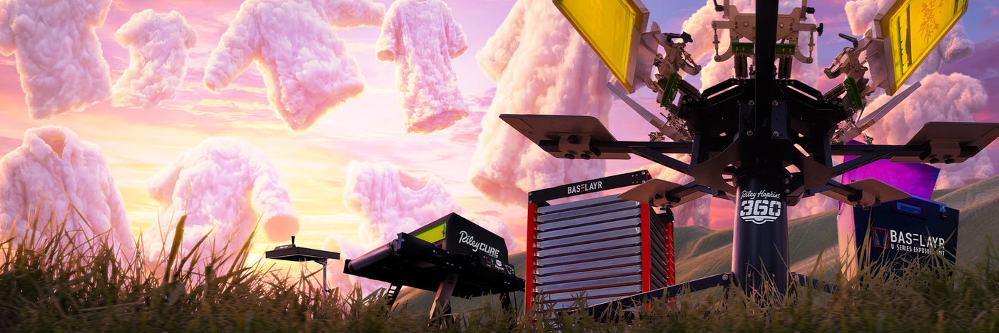 Screen-printing equipment displayed in a surreal cloudscape with T-shirt-shaped clouds, featuring the Riley Cure 246 Conveyor Dryer, Baselayr Screen Rack, Riley Hopkins 360 press, Baselayr V-Series Exposure Unit, and Riley Hopkins 16x16 Flash Dryer.