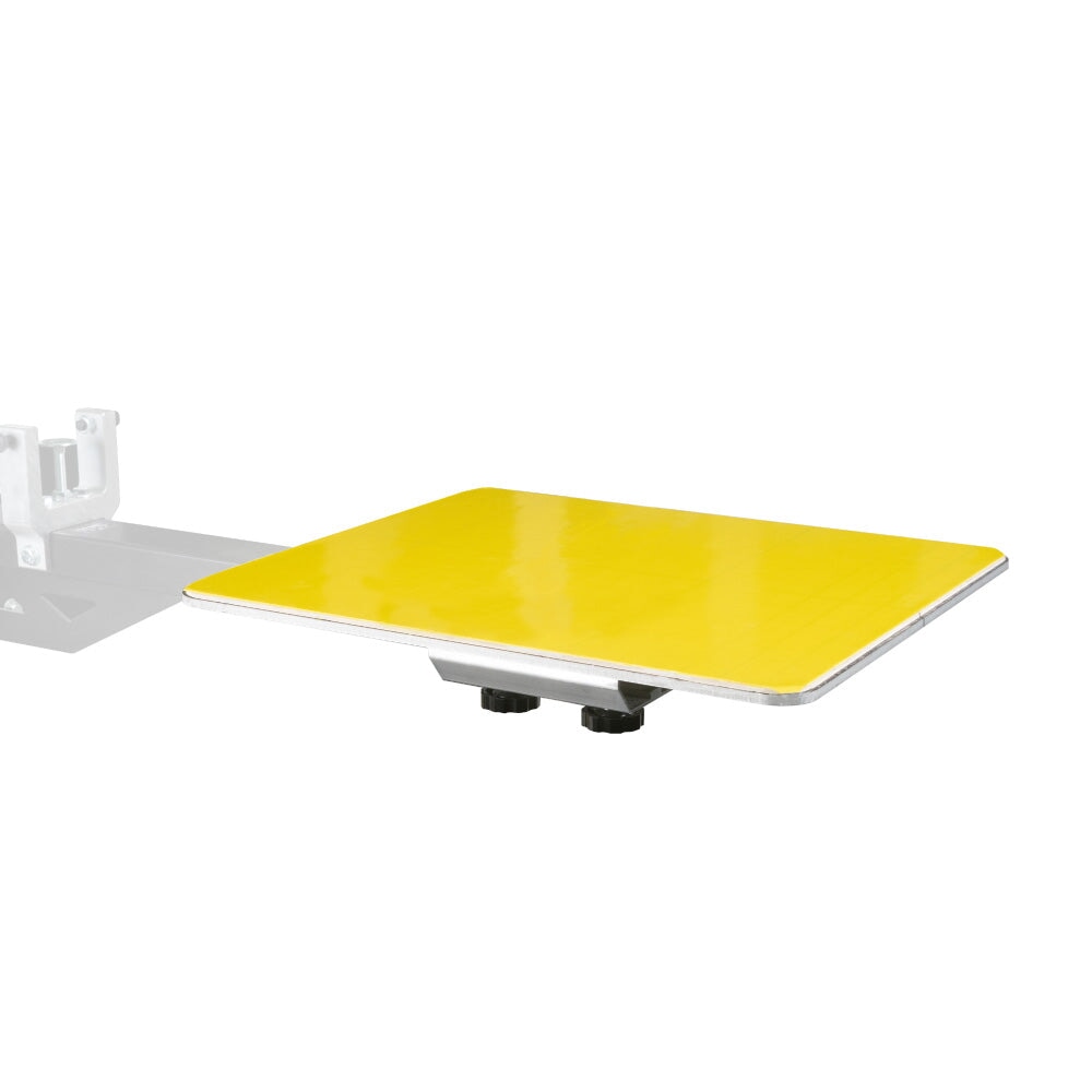 Angled view of PrintGRIP Yellow adhesive sheet on a manual screen printing platen