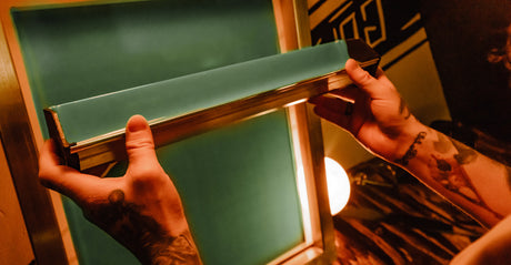 A Person Holding A Scoop Coater With Baselayr Complete Emulsion