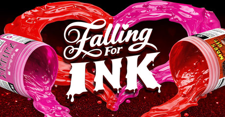 FN-INK Fuchsia and Green Galaxy Mars Red ink spill from two tubs, forming a heart-shaped splash around the words “Falling for Ink.”