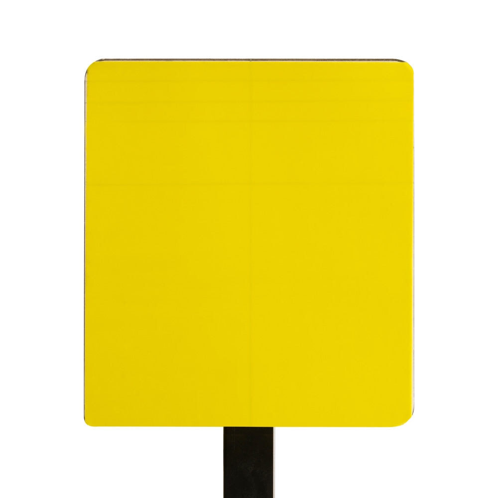Top-down view of PrintGRIP Yellow adhesive sheet on a manual screen printing platen